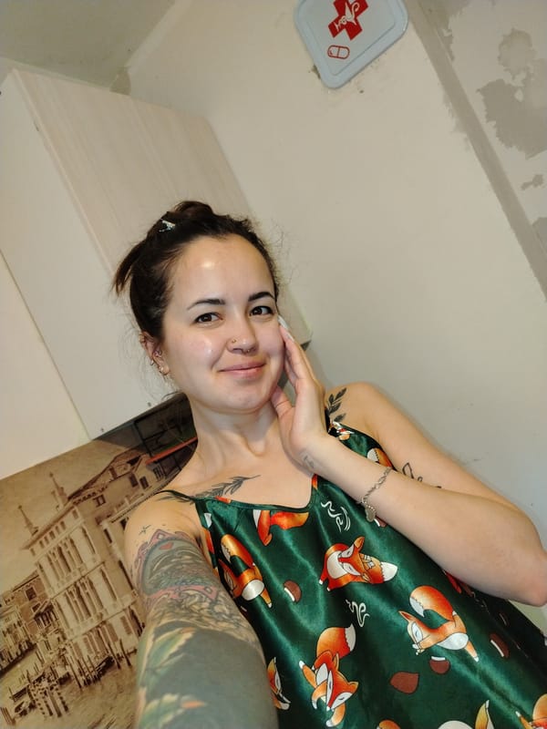 Woman takes selfie in Noviy, Russia indoor setting