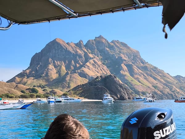 Out on the water near a dramatic Indonesian island coastline
