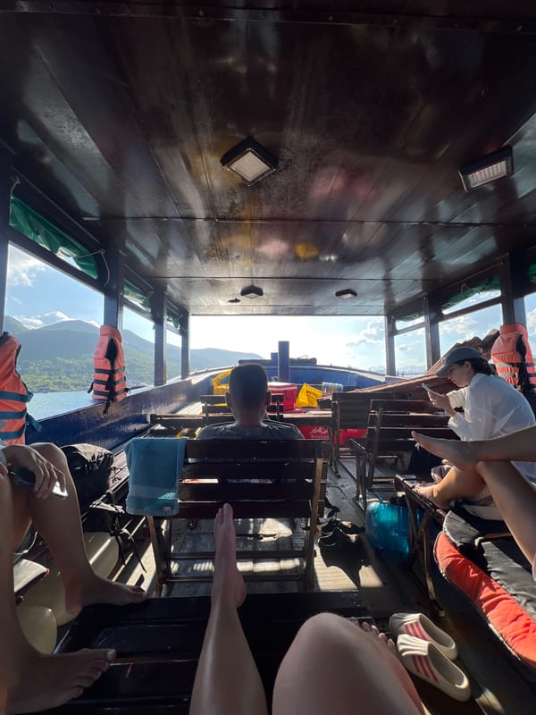 Passengers travel by boat along Vietnam coastline