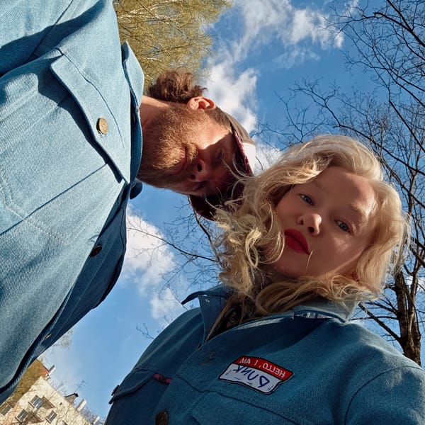 Couple photographed on sunny Saint Petersburg street in spring