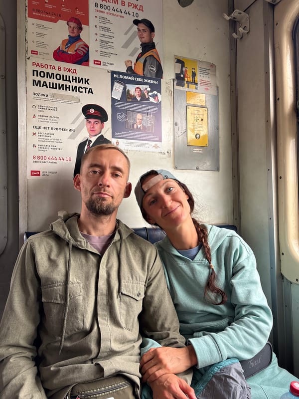 Couple takes selfie aboard train near Raevskaya, Russia