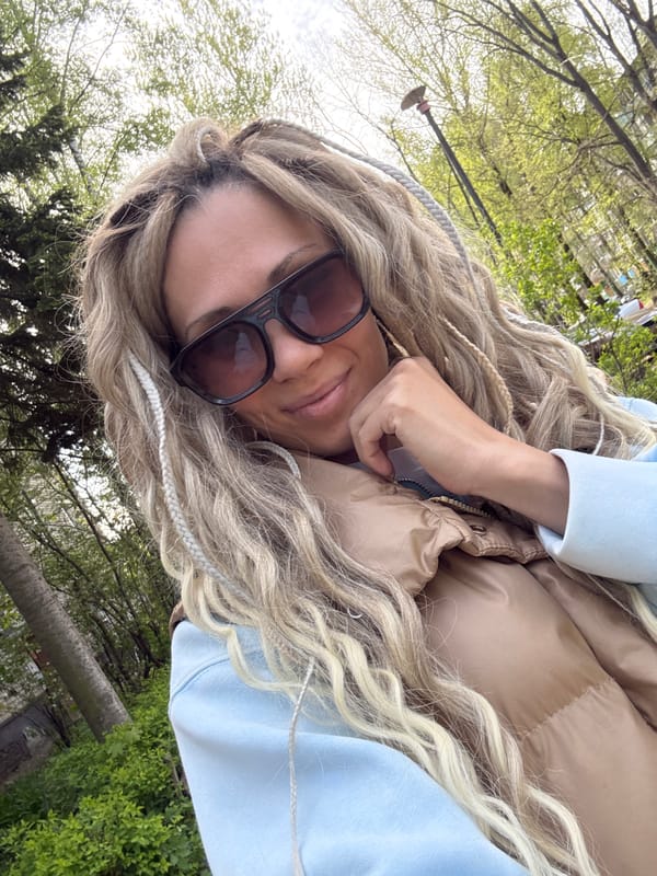 Woman takes morning selfie outdoors in casual attire