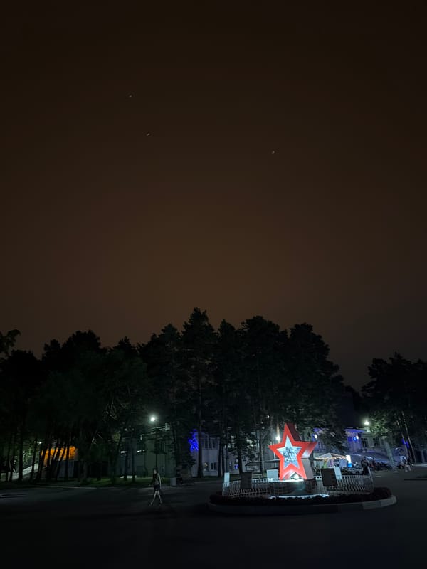 Khabarovsk at night: monuments, neon, and wet streets