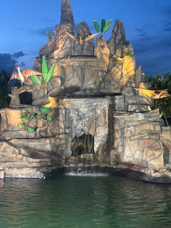 Yerevan Zoo's Dinosaur Park lit up at dusk