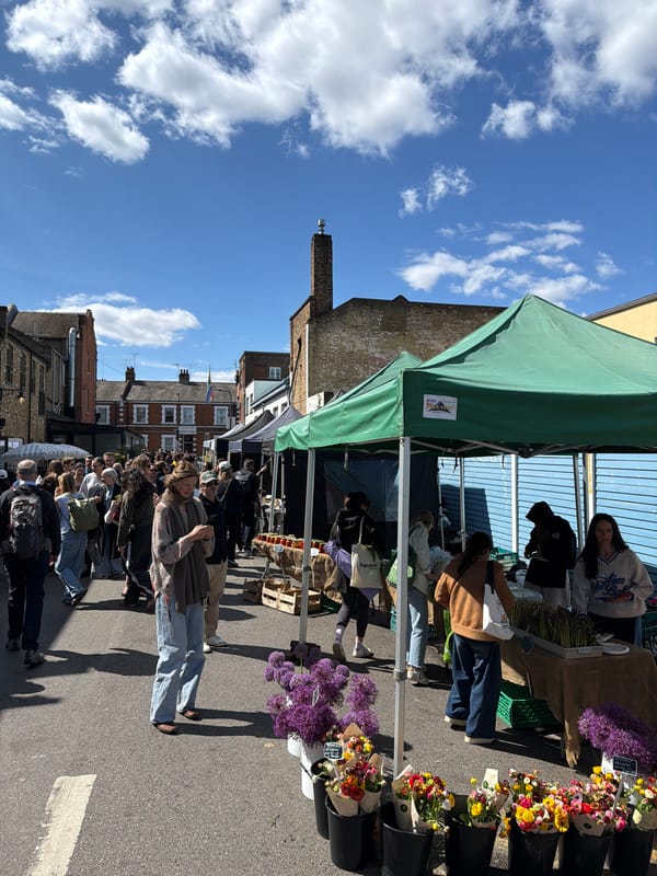 London outdoor market features flowers and Caribella products