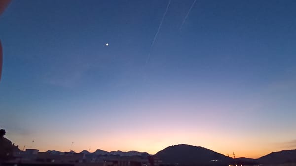 Evening sky watching captures twilight moon in Sagunto
