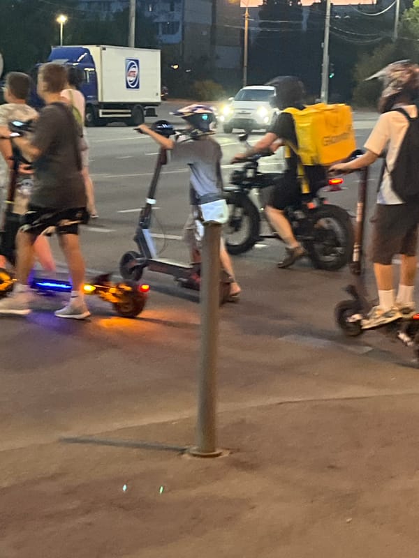 Evening scenes around Dnipro — streets, skyline, and a cyclist