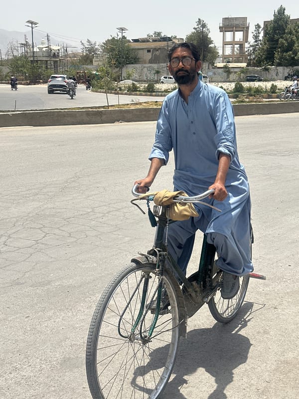Cycling through Quetta's streets in a light blue shalwar kameez