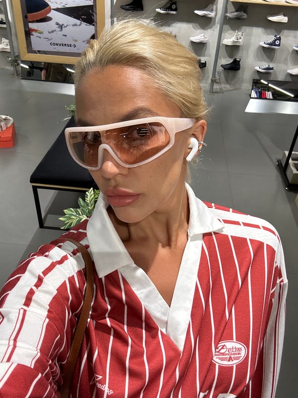 Woman takes selfies at Converse store in Kuta