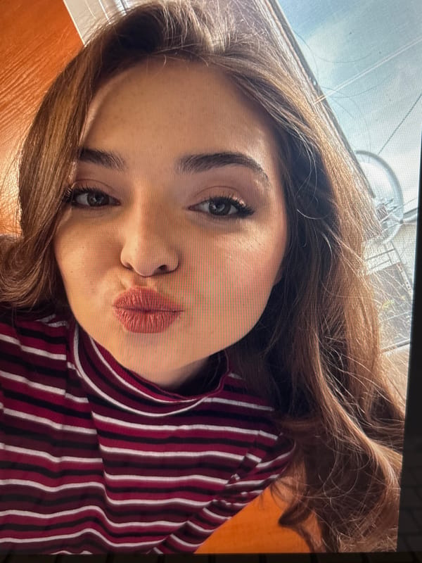 Woman takes selfie in striped turtleneck in Kostinbrod, Bulgaria