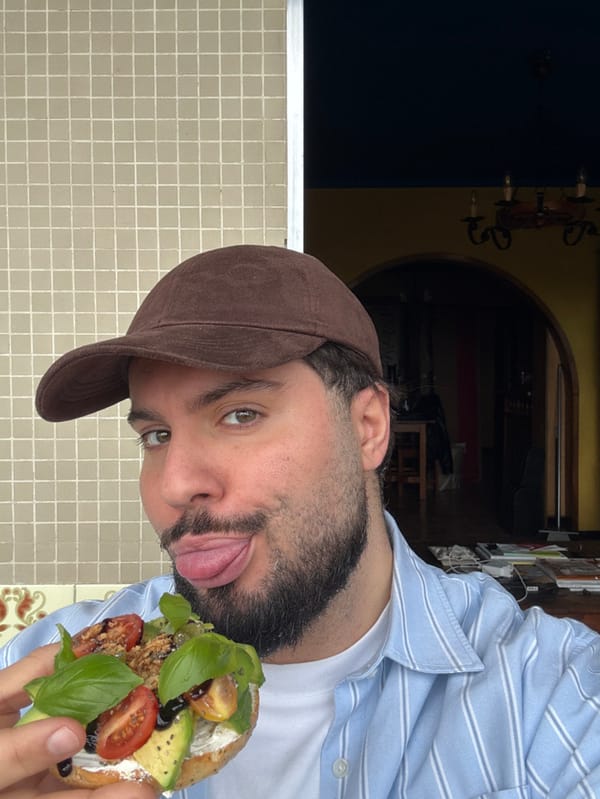 Man enjoys avocado toast breakfast in Vila Nova de Gaia
