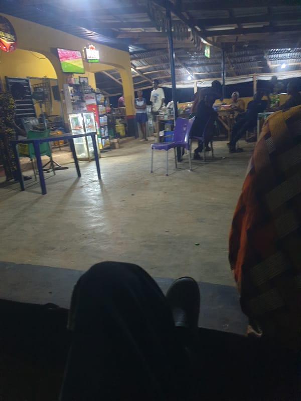 Evening social gathering at outdoor bar in Nigeria