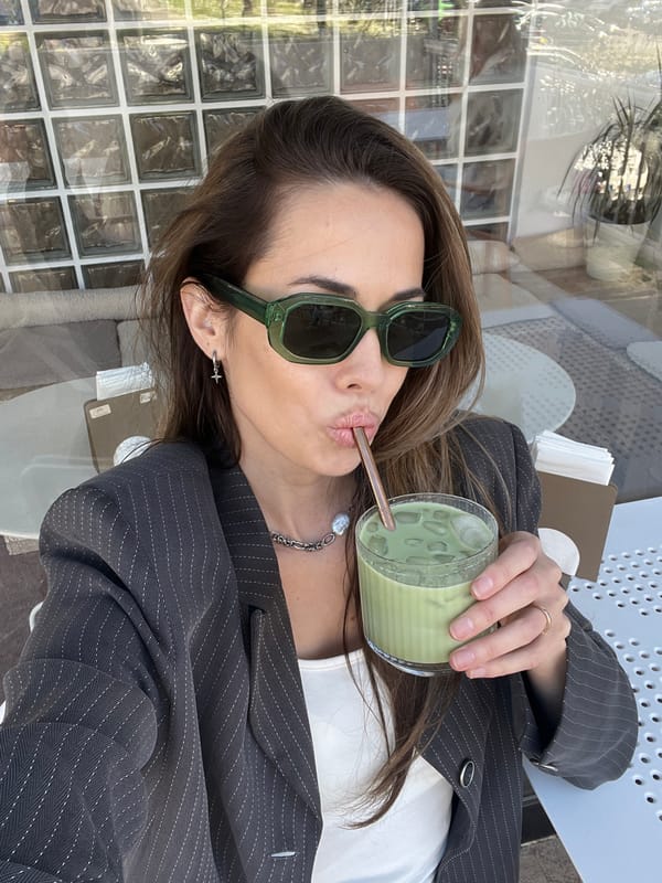 Woman enjoys matcha drinks at Montenegro cafe amid spring flowers