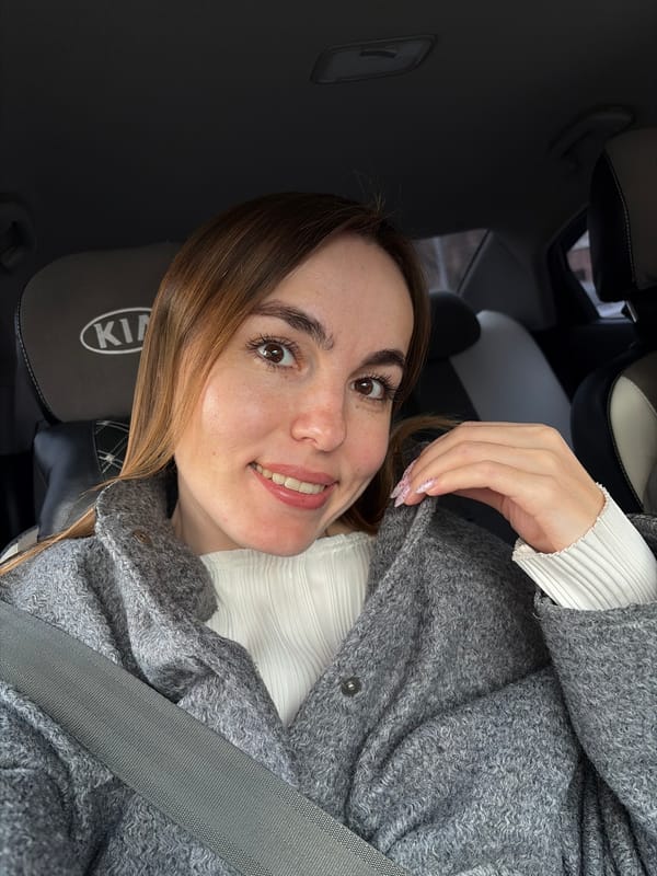 Woman takes selfies in Kia driver's seat in Izhevsk