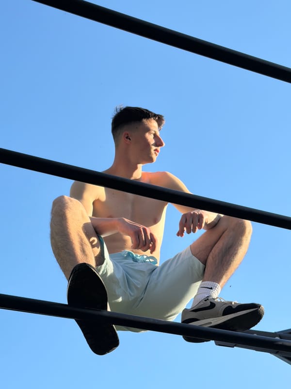 Young gymnast performs acrobatics in Burgas park during sunset