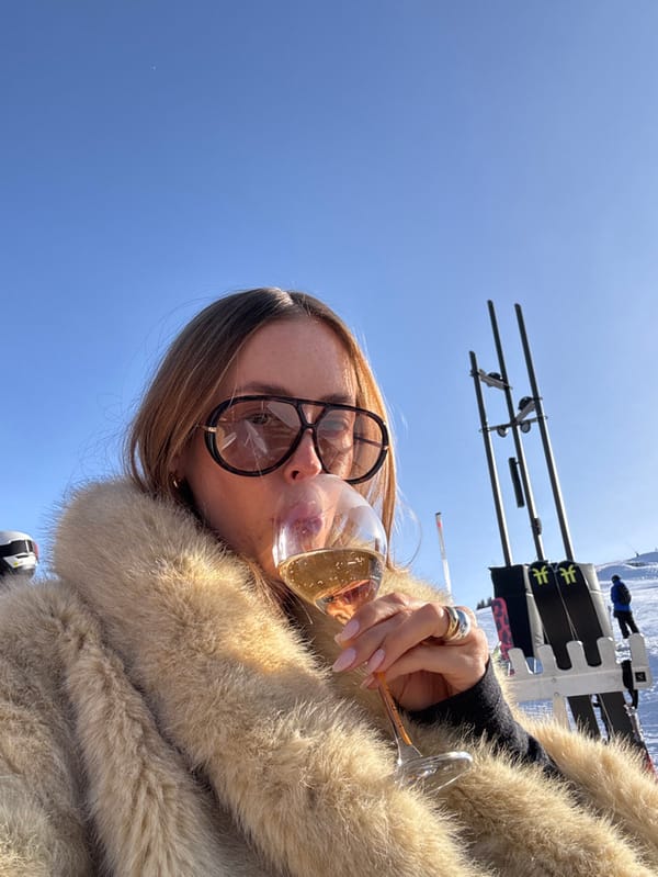 Woman enjoys après-ski drinks at Courchevel resort terrace