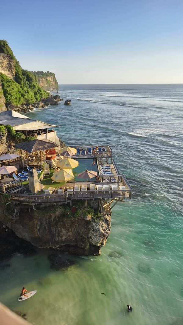 Morning clifftop party with live music overlooks surfers in Pecatu