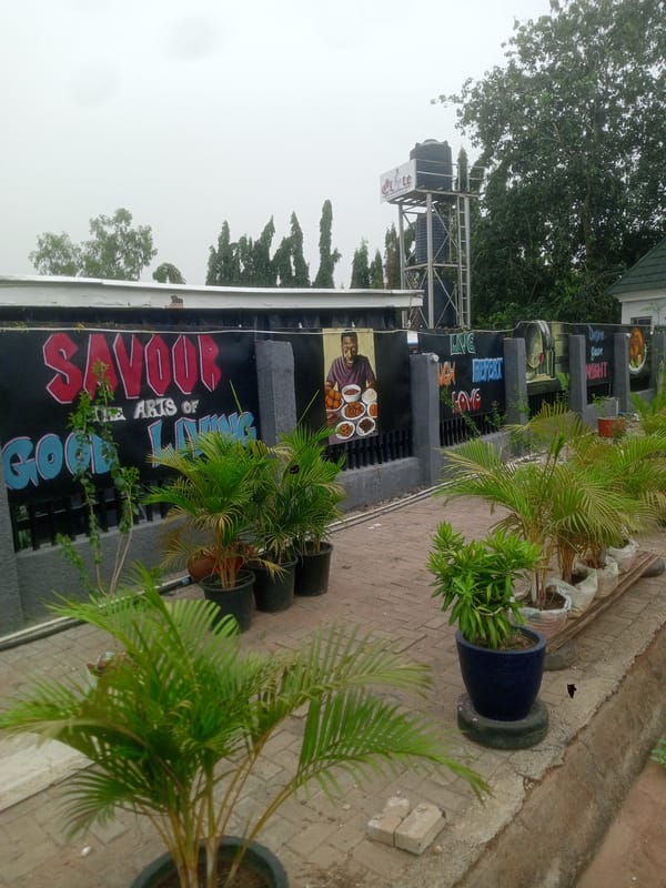 Business exterior with decorative signage documented in Gwarinpa, Nigeria
