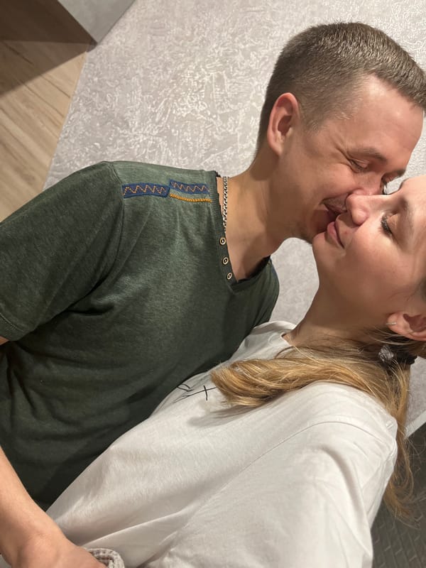Domestic evening captured: couple, cat, skincare routine in Chaikovsky