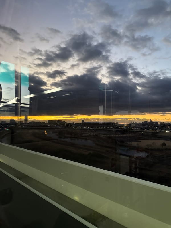 Dusk cityscape observed through window in Yokohama, Japan