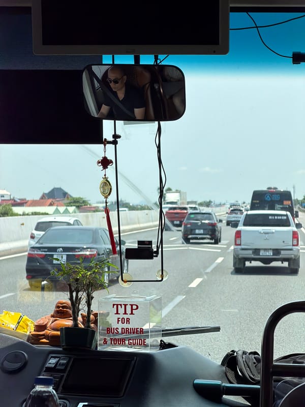 Bus passenger documents highway travel through Hải Phòng, Vietnam