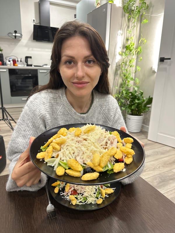 Woman prepares Caesar salads in Murino kitchen