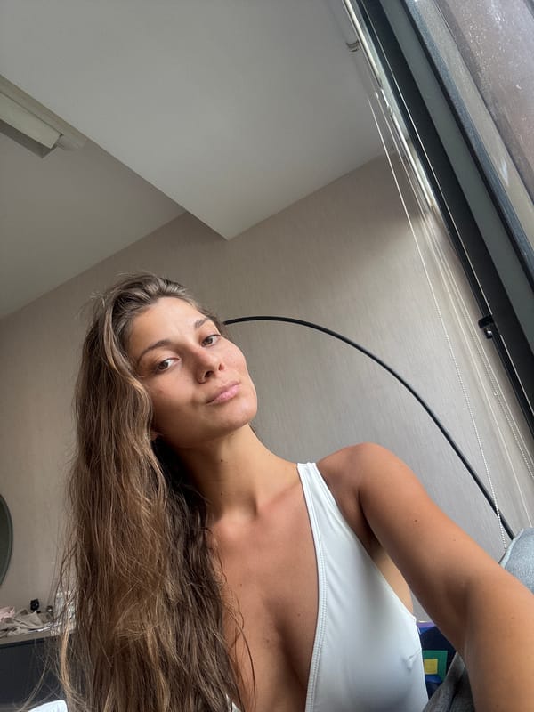 Woman photographs multiple selfies in Kuala Lumpur hotel rooms