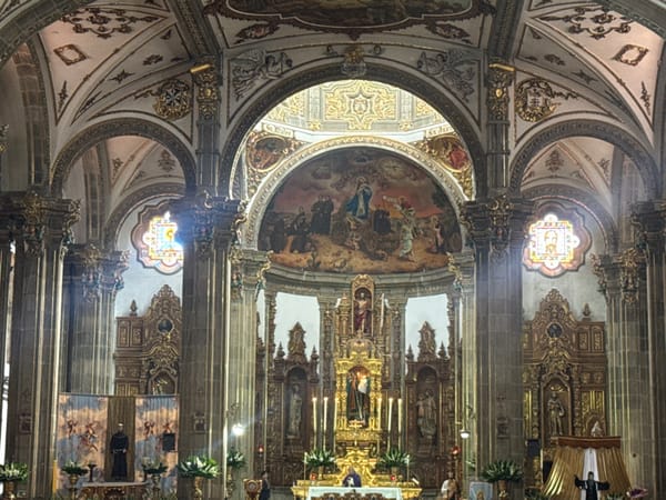 Tourist documents Mexico City churches and landmarks over afternoon
