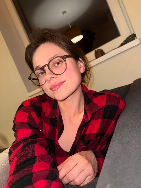 Portrait captured in Budapest shows person in plaid shirt