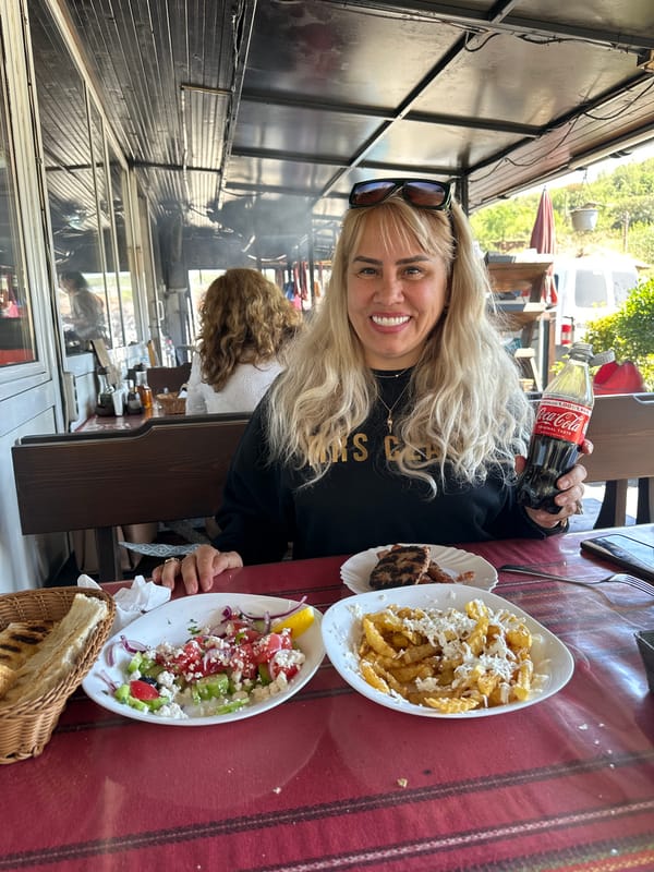 Woman enjoys traditional Bulgarian grilled meal in Kresna