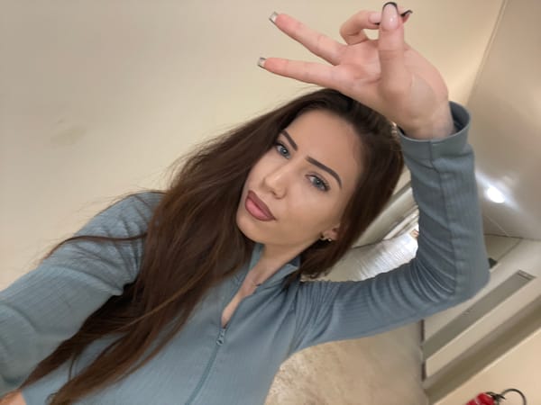 Woman takes indoor selfies in Veliko Tarnovo, Bulgaria