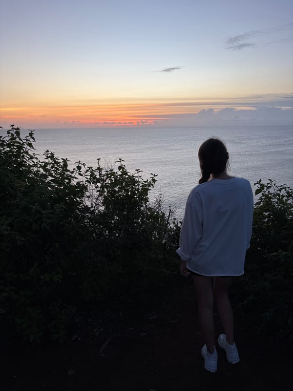 Tourists gather at Pecatu cliffs for ocean views and photos