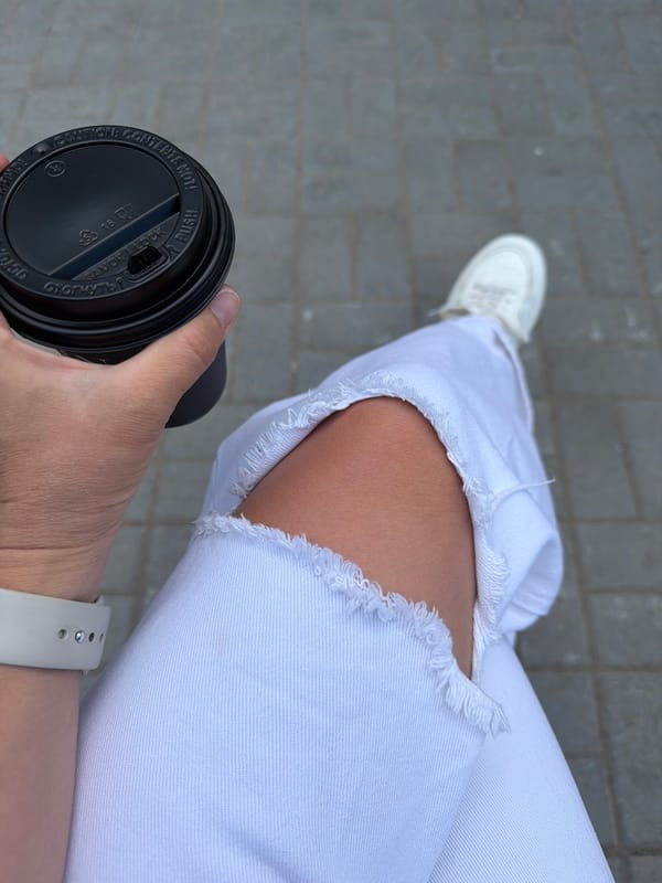 Morning coffee break captured on gray pavers in Chaikovsky