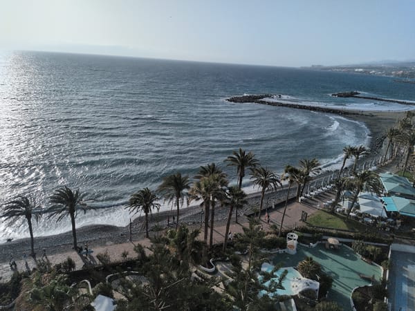 Aerial views capture Tenerife's southern coast near Las Américas