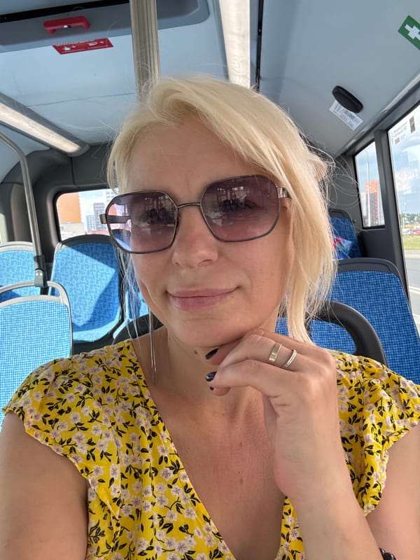 Selfie on a Moscow bus, yellow dress and sunglasses