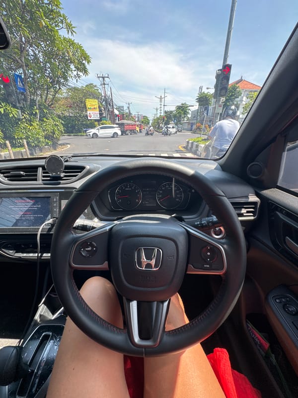 Driver waits at red light in Nusa Dua intersection