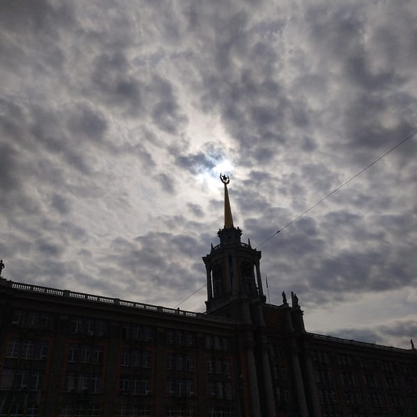 Soviet-era building photographed against cloudy sky in Yekaterinburg