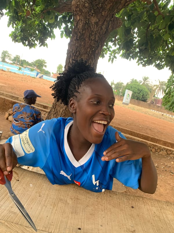 Woman photographed in soccer jersey and at sewing machine