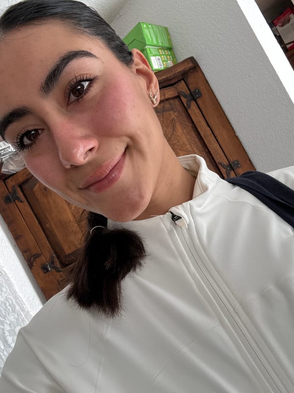 Woman takes selfie in white jacket in Puebla