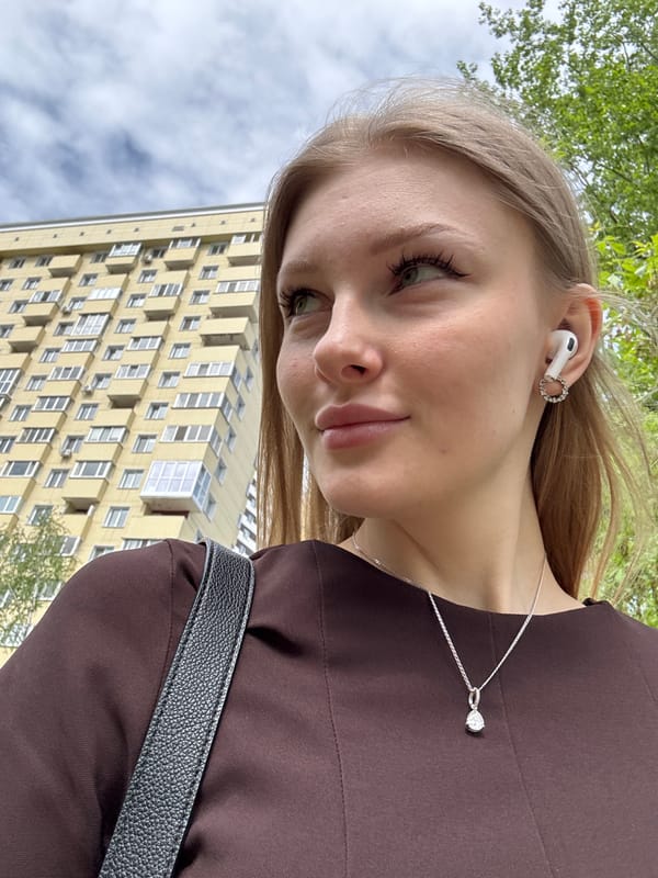 Woman takes selfies near map display in Perm, Russia