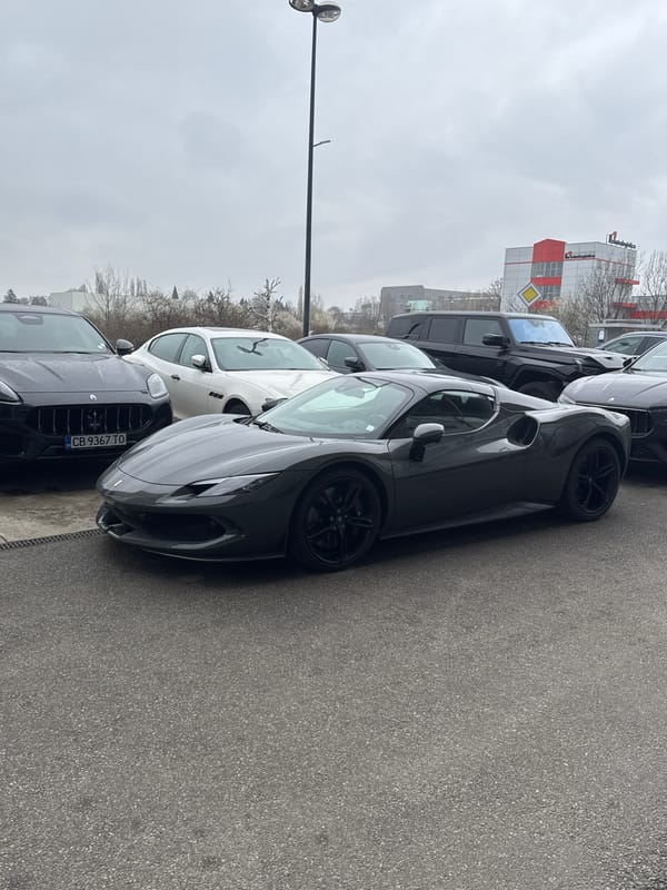 Luxury car dealership displays Ferrari and Maserati vehicles in Sofia