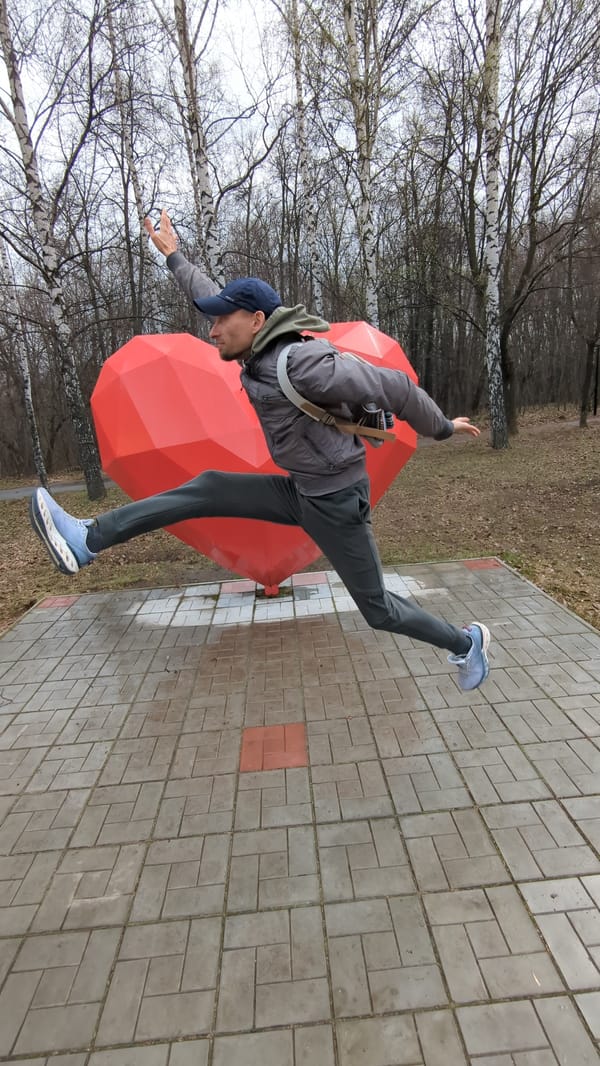Visitors pose with red heart sculpture at Ulyanovsk park