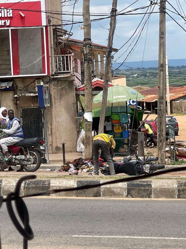 Street life and vehicle activity in a busy West African urban area