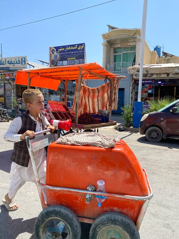 Everyday street life on a Kandahar city block