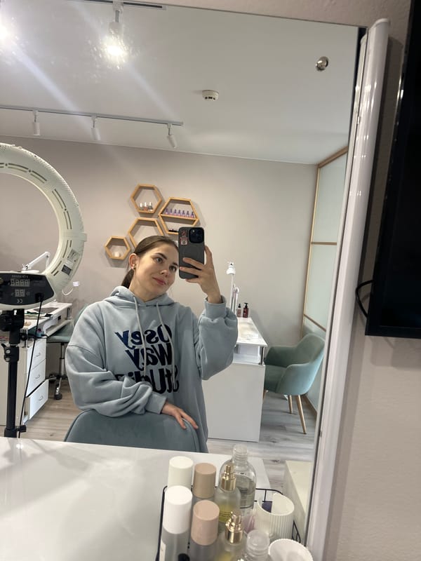 Woman takes selfie in professional studio space in Perm