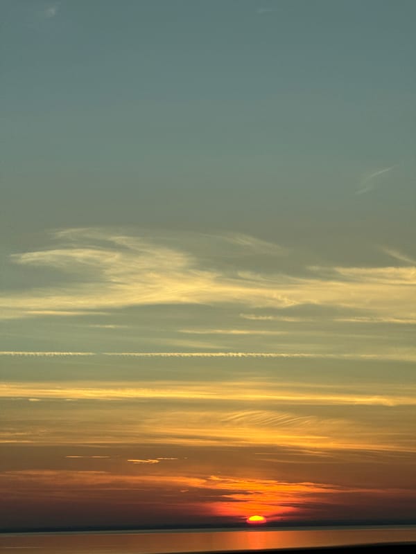 Vivid summer sunset over Danish coastal waters