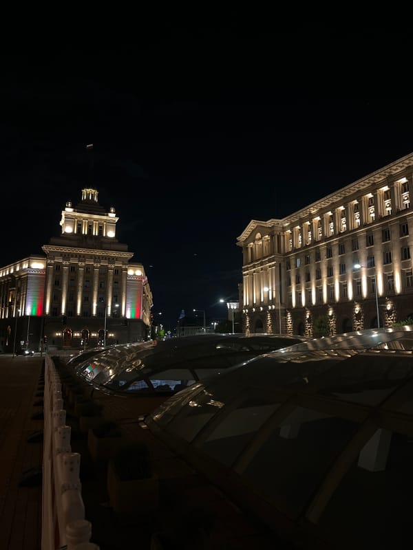 Sofia's National Assembly illuminated with Bulgarian flag colors at night