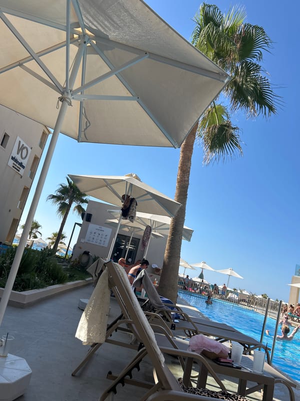 Sunny afternoon lounging at a resort pool
