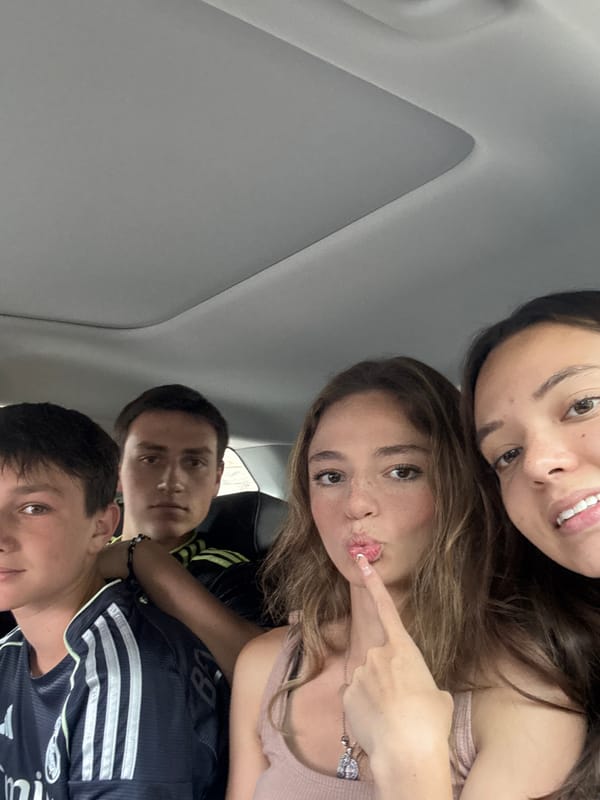 Group photographed inside vehicle in San Bernardino Tlaxcalancingo