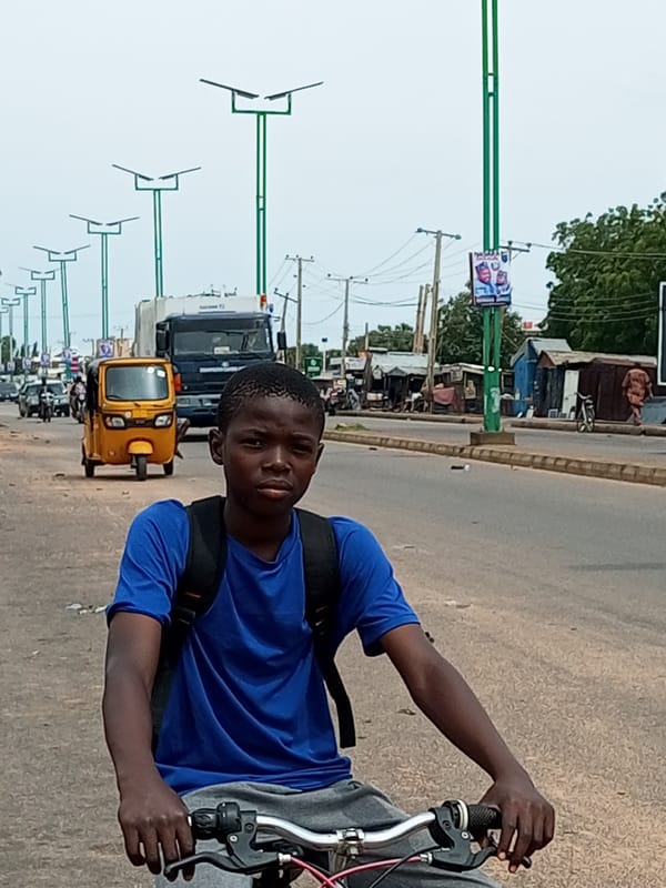 Street life and motorcycle traffic on a Garko road